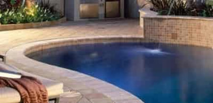 pool deck pavers in the backyard of a home